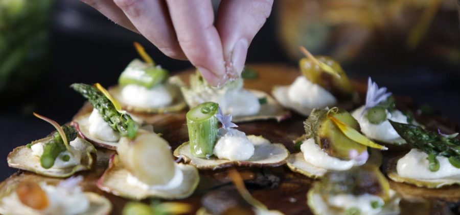 Assistant chef Michael Monteleone puts a finishing touch on cannabis-infused vegetable tarts. As more states legalize the use of recreational marijuana, the California chef is aiming to elevate haute cuisine to a new level.