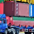 Containers are transferred at a port in Qingdao in China's eastern Shandong province on July 6. China has announced a plan to impose more tariffs on U.S. goods, in response to escalating trade threats from the Trump administration.