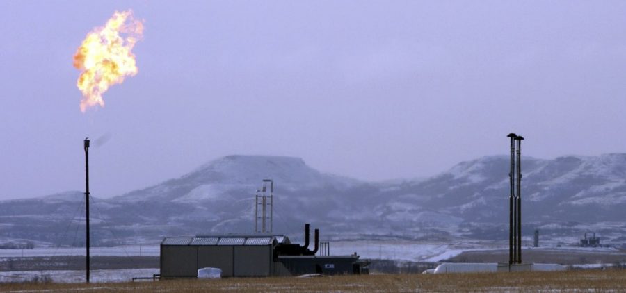 A gas flare at a natural gas processing facility near Williston, N.D. The Trump administration wants to ease regulations on methane emissions from energy production on public lands.