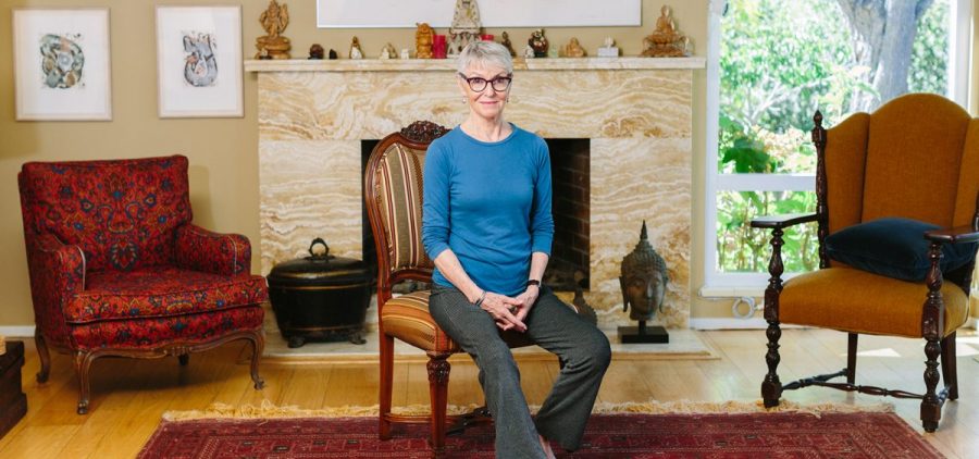 Jean Couch, 75, perches on the edge of a chair at her home in Los Altos Hills, Calif. She teaches people the art of sitting in chairs without back pain.