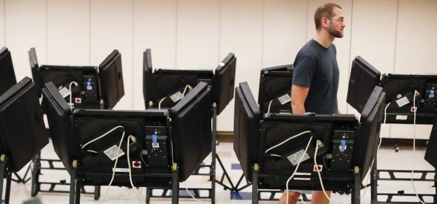 Voters cast their ballots in August among an array of electronic voting machines in a polling station at the Noor Islamic Cultural Center in Dublin, Ohio. The machines were manufactured by Elections Systems and Software, the largest manufacturer of voting equipment in the country.
