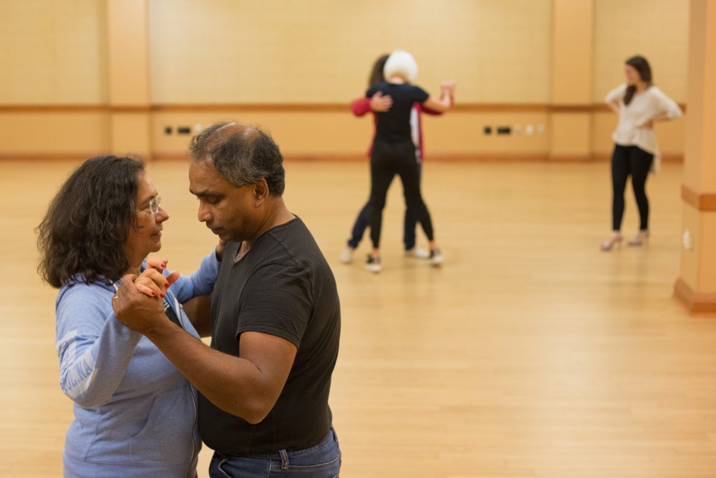 Claudia González Vallejo (left) and Chris Demel practice the back ocho as Tango Club comes to an end in Baker Student Center at Ohio University on Thursday, October 11, 2018. (Hannah Schroeder/ WOUB)