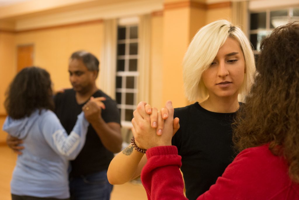 Tanya Tytko (left) and Tracy Shust practice the basic step next to Claudia González Vallejo and her husband Chris Demel during Tango Club in Baker Student Center at Ohio University on Thursday, October 11, 2018. (Hannah Schroeder/ WOUB)