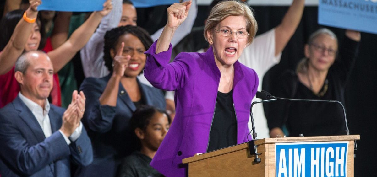 Sen. Elizabeth Warren speaks at a rally for Democratic gubernatorial candidate Jay Gonzalez (left) and congressional Democratic candidate Ayanna Pressley (second from left).