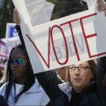 Women gather for a rally and march at Grant Park on Saturday in Chicago to urge voter turnout ahead of the midterm elections.