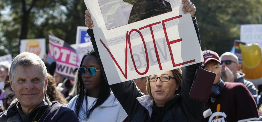 Women gather for a rally and march at Grant Park on Saturday in Chicago to urge voter turnout ahead of the midterm elections.