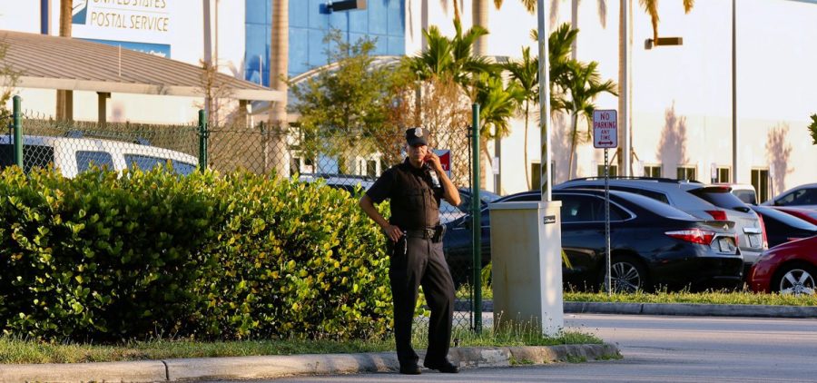Police outside the U.S. Post Office Royal Palm Processing & Distribution Center, in Opa-locka, Fla. on Thursday.