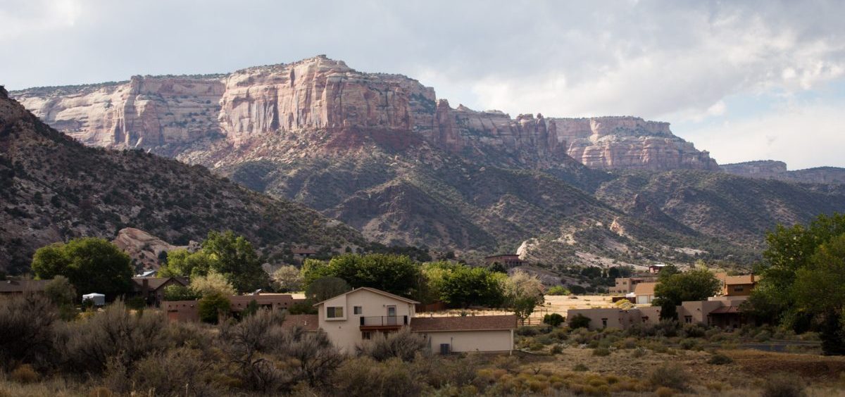 Houses lie at the base of Colorado National Monument. The school district in Grand Junction knows it could take years to see whether their efforts towards suicide prevention have worked.