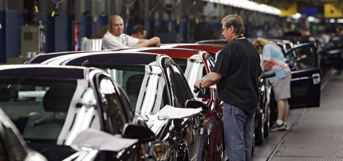 Workers at General Motors' Lordstown Assembly plant in Lordstown, Ohio put the final touches on Chevy Cobalts.