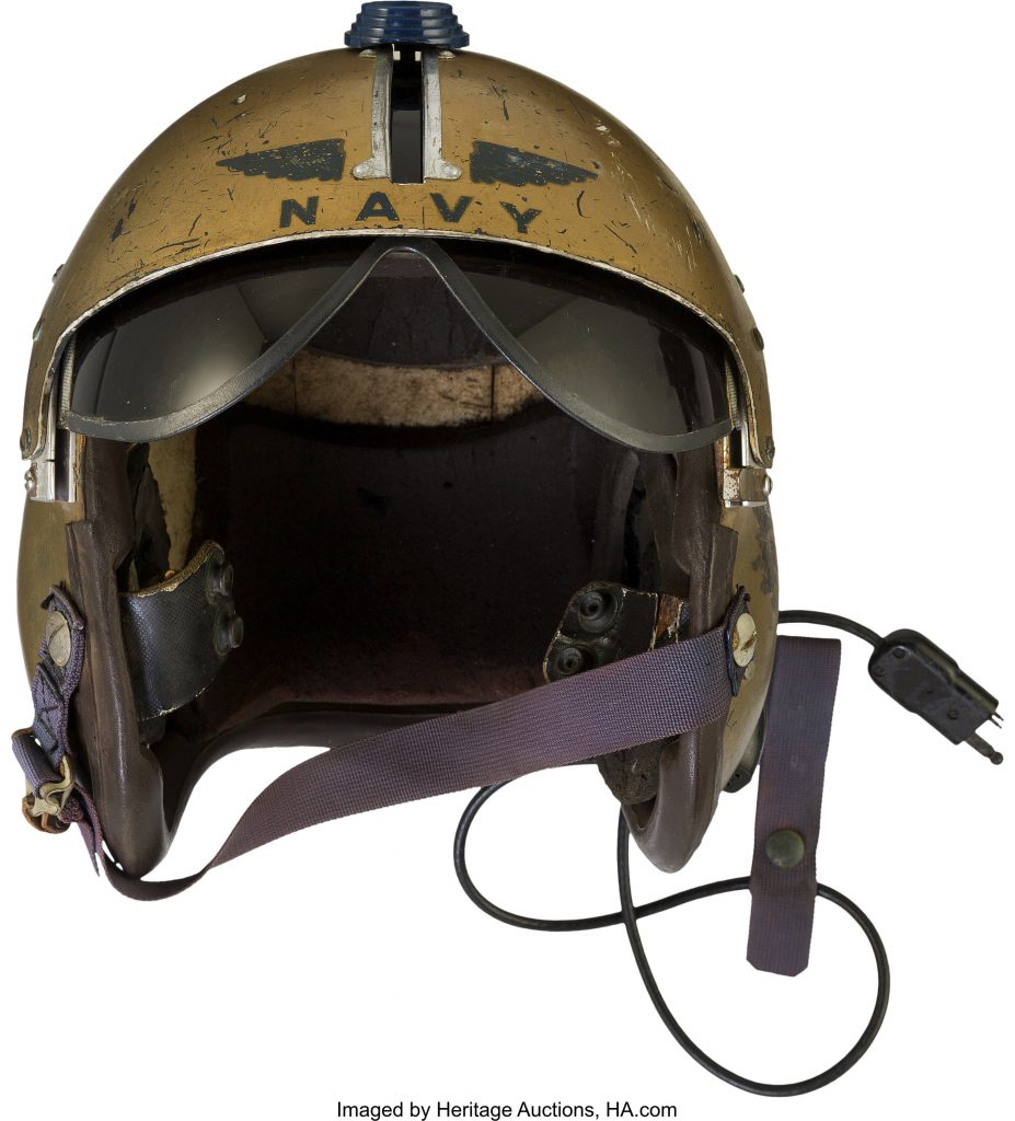 This undated photo provided by Heritage Auctions shows a helmet worn by John Glenn during the history-making flight, dubbed Project Bullet, in which the future astronaut set the transcontinental speed record in 1957.  Artifacts owned by the late Neil Armstrong will be offered for sale by Dallas-based Heritage Auctions starting Thursday, Nov. 1, 2018,  including pieces of a wing and propeller from the 1903 Wright Flyer the astronaut took with him to the moon in 1969.   (Courtesy of Heritage Auctions via AP)