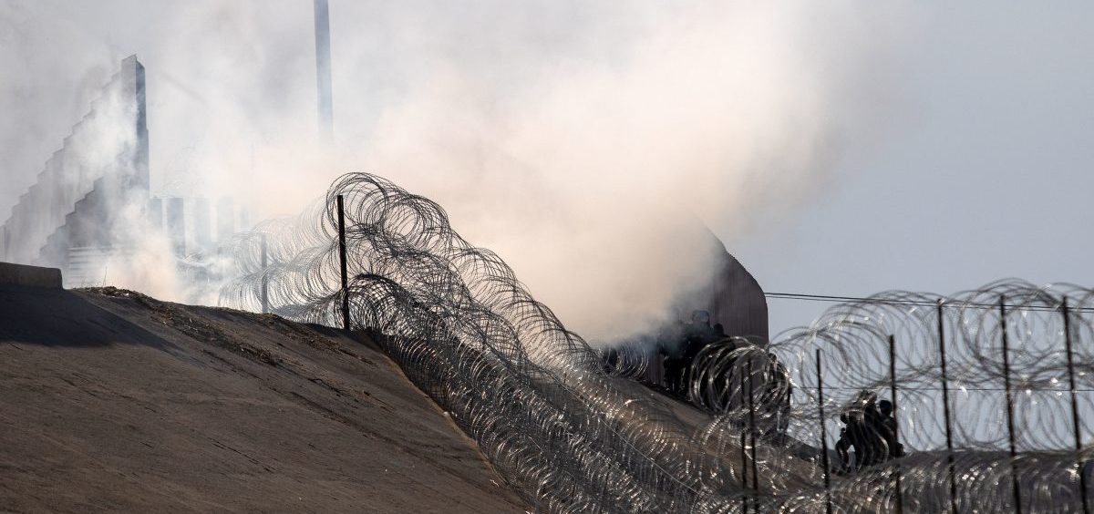 Tear gas thrown by U.S. border agents is seen near the border crossing in Tijuana, Mexico, on Sunday.