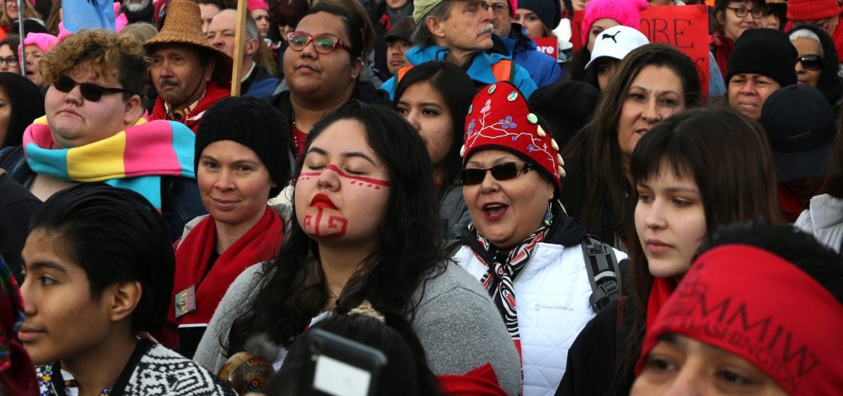 People listen to speakers raising awareness about missing and murdered Indigenous women at a rally at Cal Anderson Park in Seattle prior to the Women's March on January 20. A new report examines missing and murdered Indigenous women in cities, not on reservations, and found local law enforcement agencies often do not adequately track such crimes.
