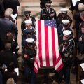 A joint service honor guard carries the casket of former President George H.W. Bush at the end of his State Funeral.