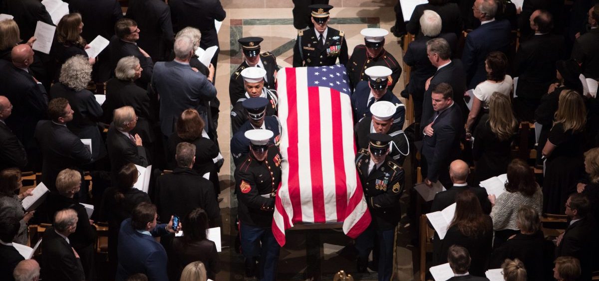 A joint service honor guard carries the casket of former President George H.W. Bush at the end of his State Funeral.