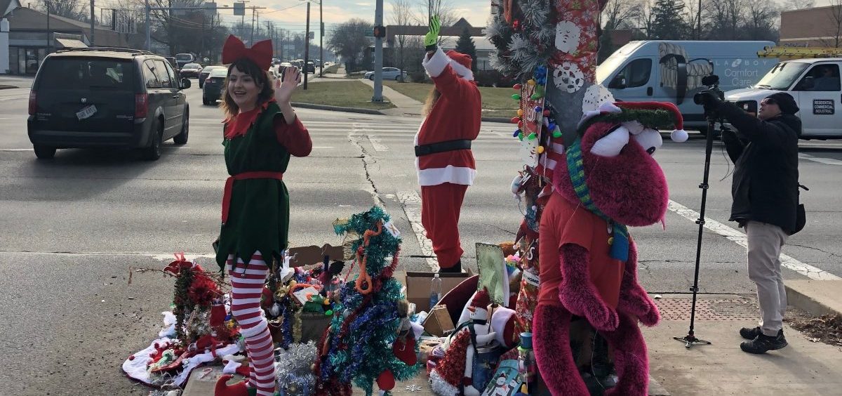 Toledo's Christmas Weed (upper left corner), which is now so heavily decorated that you can barely see it, provided a little holiday cheer at a busy intersection Wednesday.