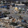 The devastation from Hurricane Michael over Mexico Beach, Fla. A massive federal report released in November warns that climate change is fueling extreme weather disasters like hurricanes and wildfires.