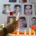 Journalists light candles in Siliguri, India, on May 3, during a vigil for Afghan journalists who were killed in a targeted suicide bombing in Kabul on April 30.