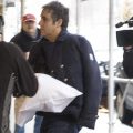 Michael Cohen dodges photojournalists as he returns home in New York City. The former fixer for Donald Trump says he's postponing testimony planned for a House hearing next month.
