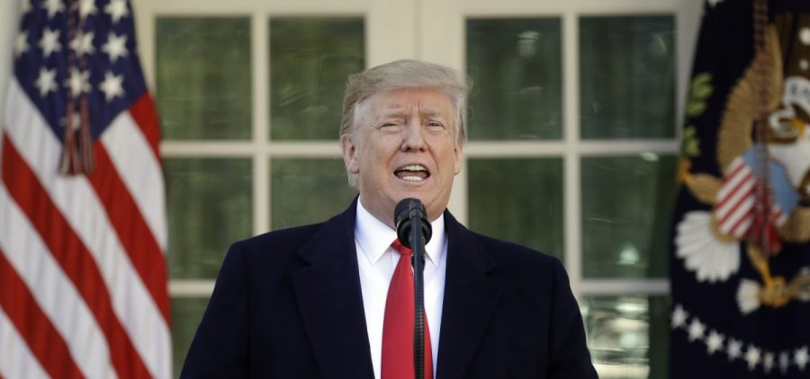 President Trump speaks in the Rose Garden of the White House on Friday, saying he will endorse a short-term spending deal to end the government shutdown.