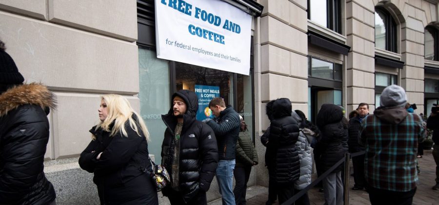 Federal workers stand in line for a free hot meal in Washington, D.C., on Wednesday.