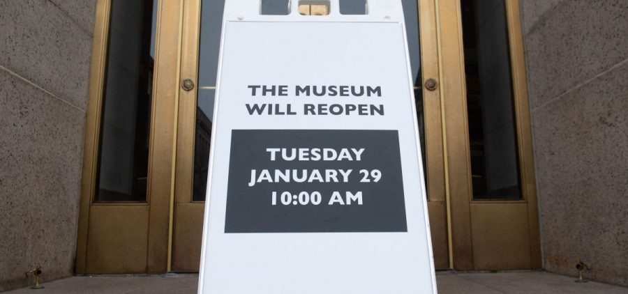 A sign at the entrance of the Smithsonian National Museum of Natural History in Washington, D.C., says the museum will reopen Tuesday. The shutdown reduced federal spending by $18 billion, although most of that will be recouped, now that the government has reopened, according to a new report.