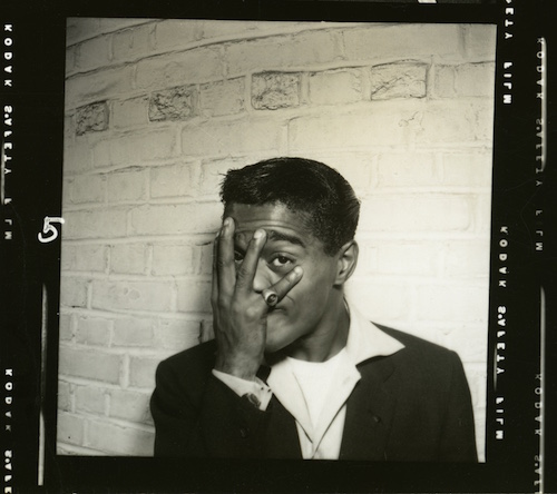 Sammy Davis, Jr. with hand over face