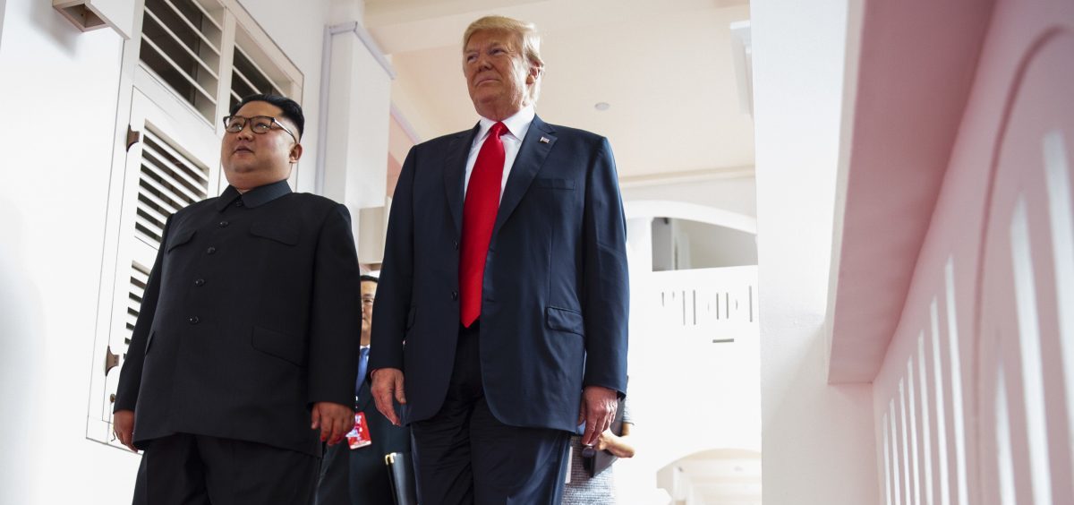 North Korea's leader Kim Jong Un and President Trump walk together at a resort on Sentosa Island in Singapore on June 12, 2018.