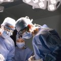 The common practice of double-booking a lead surgeon's time and letting junior physicians supervise and complete some parts of a surgery is safe for most patients, a study of more than 60,000 operations finds. But there may be a small added risk for a subset of patients.