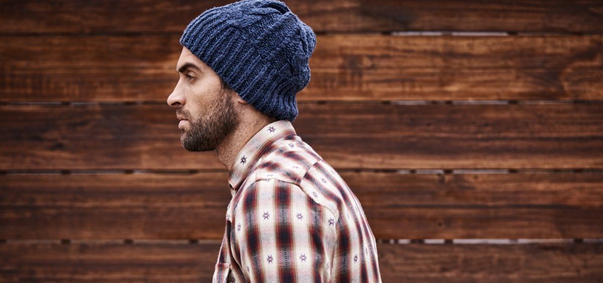 This is the unedited version of a contested photo from an MIT Technology Review article on hipsters. Original caption: "Shot of a handsome young man in trendy winter attire against a wooden background."
