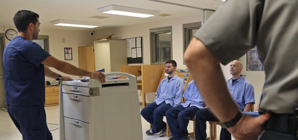 In Massachusetts last July, several Franklin County Jail inmates, seated, were watched by a nurse (left) and a corrections officer after receiving their daily doses of buprenorphine, a drug that helps control opioid cravings. By some estimates, at least half to two thirds of today's U.S. jail population has a substance use or dependence problem.
