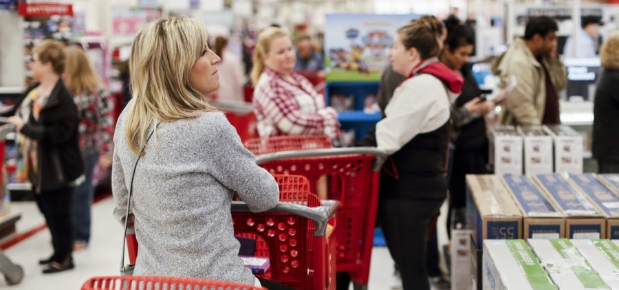 Shoppers wait in line at a Target store in Newport, Ky., on Nov. 29, 2018. Strong consumer spending boosted analysts' economic growth forecasts for the first quarter of 2019.