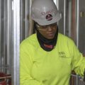 Plumber Zakiyyah Askia welds pipes at a high-rise residence under construction in Chicago on Jan. 24. U.S. employers added 196,000 jobs in March, a rebound from February's weak growth, the Labor Department said Friday.