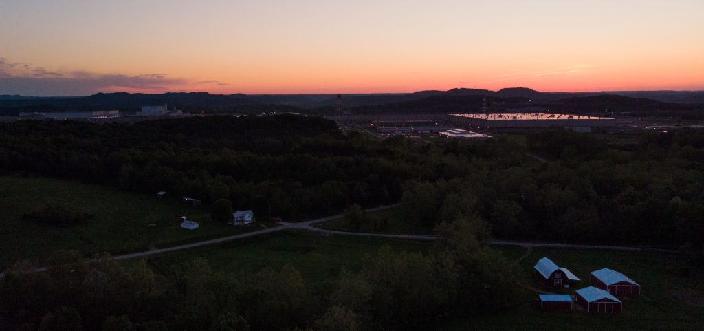 The sun sets over the Portsmouth Gaseous Diffusion Plant in Pike County, Ohio on May 6, 2019.  Earlier this week, a number of Pike County residents filed a lawsuit alleging more than 2,000 people are adversely affected by the release of radioactive materials from the plant.
