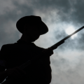silhouette of man with rifle