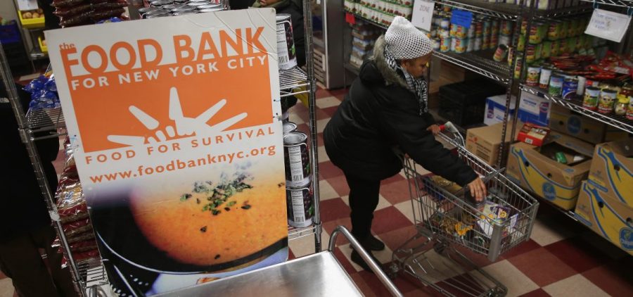 Harlem residents choose free groceries at the Food Bank For New York City in 2013. A number of new rules and actions proposed by the Trump administration could affect poor or low-income people who take advantage of government safety net programs.