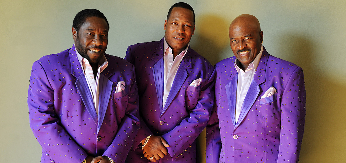 The band The O'Jays in matching purple jackets