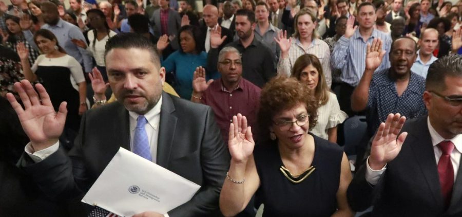 New citizens take the oath of allegiance during a naturalization ceremony in Oakland Park, Fla., earlier this year. The Trump administration has announced there will be changes to the U.S. citizenship test.
