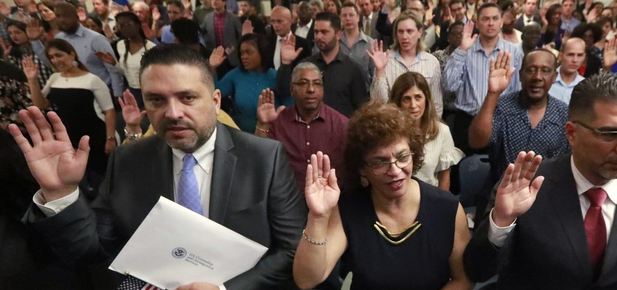 New citizens take the oath of allegiance during a naturalization ceremony in Oakland Park, Fla., earlier this year. The Trump administration has announced there will be changes to the U.S. citizenship test.