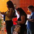 Job applicants wait in line at the Seminole Hard Rock Hotel & Casino Hollywood during a job fair in Hollywood, Fla., on Thursday.