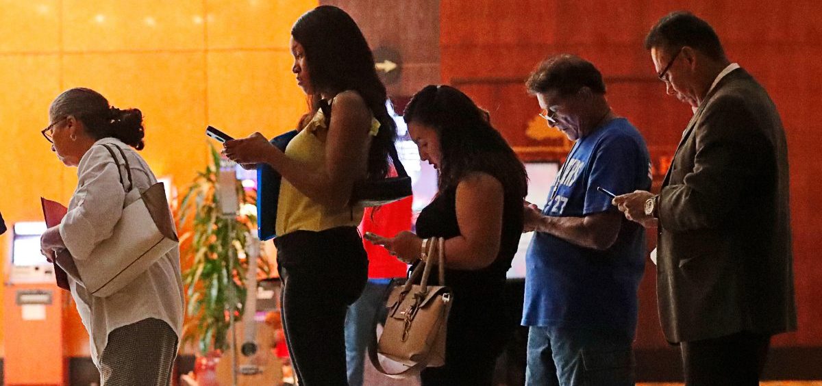Job applicants wait in line at the Seminole Hard Rock Hotel & Casino Hollywood during a job fair in Hollywood, Fla., on Thursday.