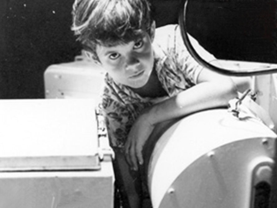 Ten-year-old Greg Force in 1969, greasing the antenna bearing at the NASA tracking station in Guam.