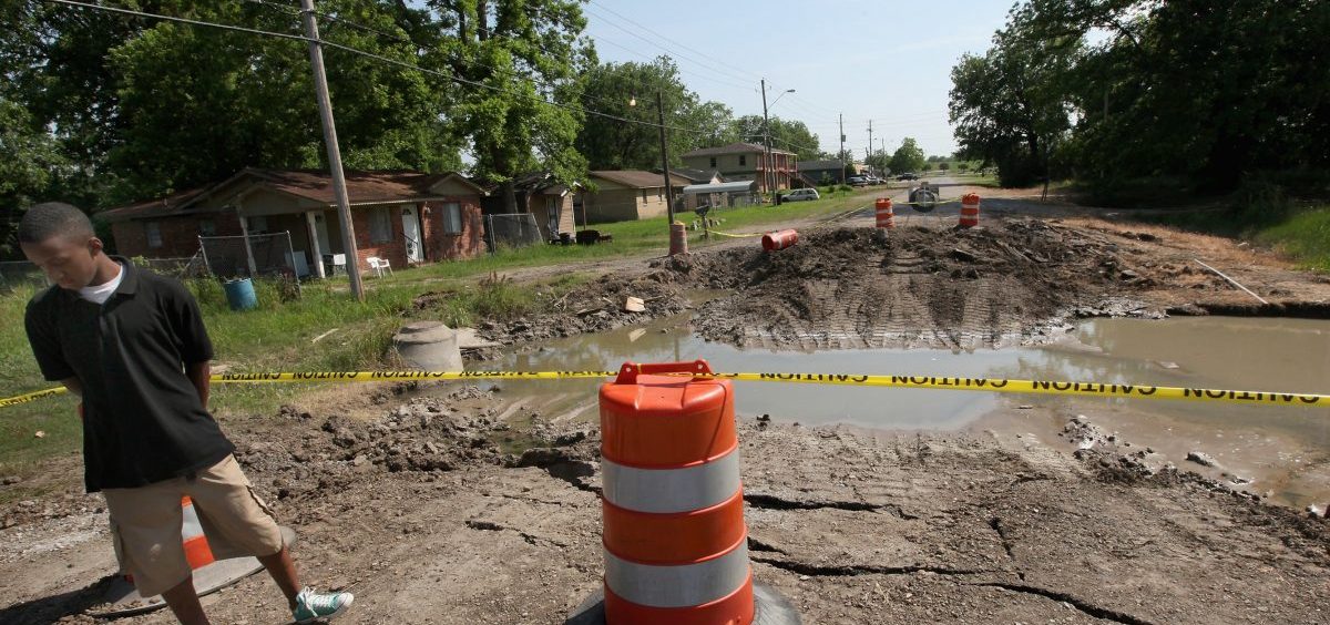 Water that came under a levee in Greenville, Miss., in 2011 caused this street to collapse. The city has had major floods twice since then, including record-breaking high water this year. Greenville's mayor says many residents live in low-lying areas served by outdated infrastructure.