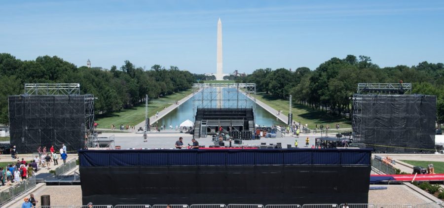 Workers build a stage and bleachers Monday for the "Salute to America" Fourth of July event with President Trump at the Lincoln Memorial on the National Mall.