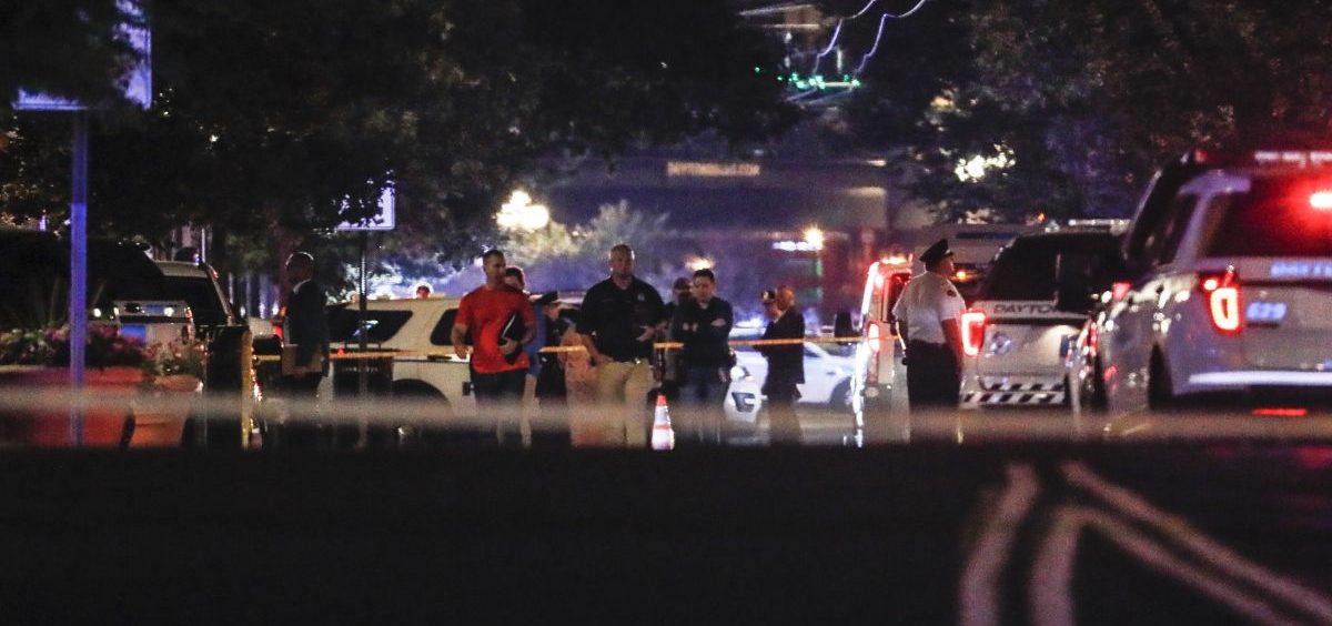 Authorities work the scene of a mass shooting, Sunday, Aug. 4, 2019, in Dayton, Ohio.