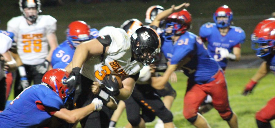 Belpre back fights through tackle