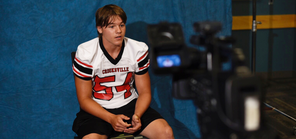 Crooksville player gets interviewed by reporter.