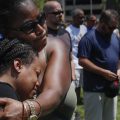 Mourners gather at a vigil following a nearby mass shooting on Sunday in Dayton, Ohio.
