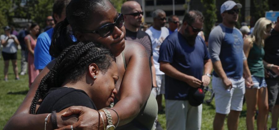 Mourners gather at a vigil following a nearby mass shooting on Sunday in Dayton, Ohio.