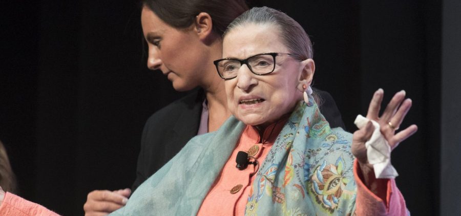 Justice Ruth Bader Ginsburg waves to the crowd at the Library of Congress National Book Festival on Saturday.
