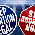 Signs argue both sides of the abortion debate
